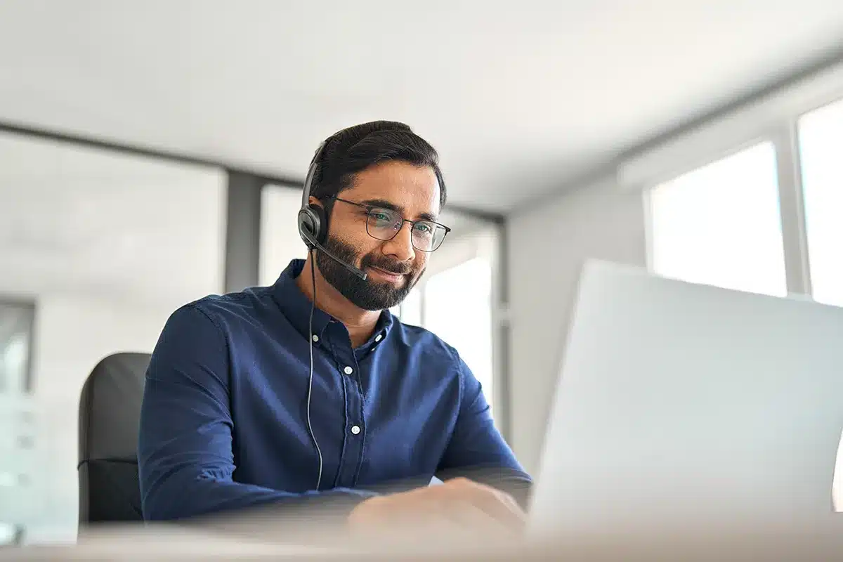 support-specialist-sitting-at-table support specialist sitting at table